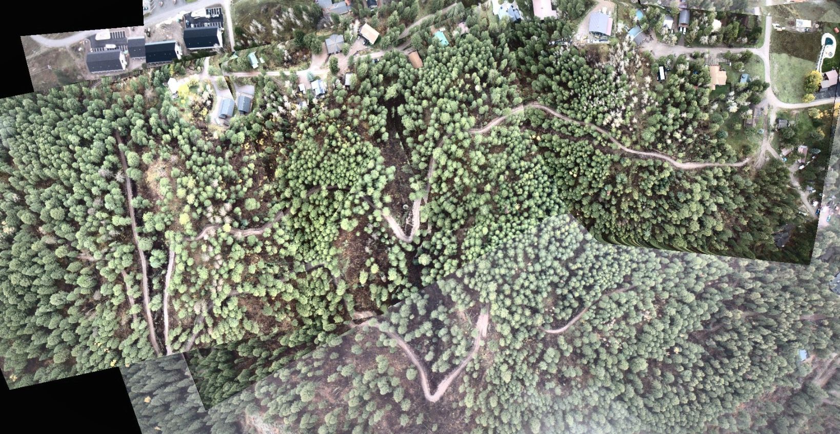 Drone photos stitched into one map, with the new roads drawn on top